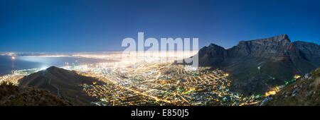 Night-time, moonlit panoramic of the city of Cape Town and Table Mountain. Stock Photo