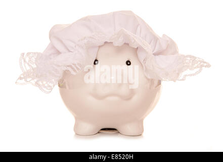 piggy bank wearing maids bonnet cutout Stock Photo