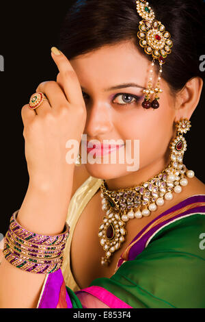 Closeup shot of a female's hands with diamonds on the nails grabbing a