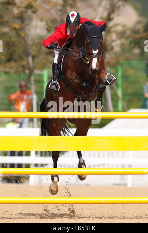 Incheon, South Korea. 30th Sep, 2014. Taizo Sugitani (JPN) Equestrian : Jumping Individual Final at Dream Park Equestrian Venue during the 2014 Incheon Asian Games in Incheon, South Korea . © AFLO SPORT/Alamy Live News Stock Photo