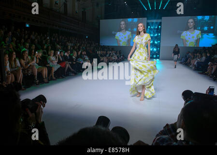 SYDNEY, AUSTRALIA - SEPTEMBER 27: A model showcases designs for MacGraw on the runway during MB Presents Australian Style show at Mercedes-Benz Fashion Festival Sydney at Sydney Town Hall on September 27, 2014 in Sydney, Australia. Stock Photo