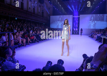 SYDNEY, AUSTRALIA - SEPTEMBER 27: A model showcases designs for Swarovski on the runway during MB Presents Australian Style show at Mercedes-Benz Fashion Festival Sydney at Sydney Town Hall on September 27, 2014 in Sydney, Australia. Stock Photo