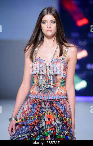 SYDNEY, AUSTRALIA - SEPTEMBER 27: A model showcases designs for Camilla on the runway during MB Presents Australian Style show at Mercedes-Benz Fashion Festival Sydney at Sydney Town Hall on September 27, 2014 in Sydney, Australia. Stock Photo