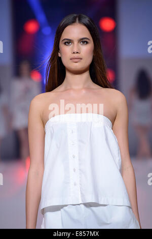 SYDNEY, AUSTRALIA - SEPTEMBER 27: A model showcases designs for Uniem on the runway during MB Presents Australian Style show at Mercedes-Benz Fashion Festival Sydney at Sydney Town Hall on September 27, 2014 in Sydney, Australia. Stock Photo