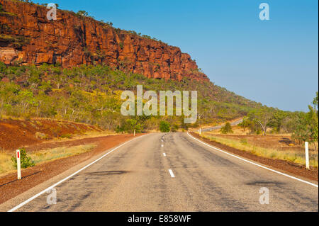 Road, red cliffs, Northern Territory, Australia Stock Photo