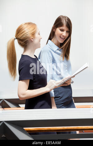 Colleagues discussing work together Stock Photo
