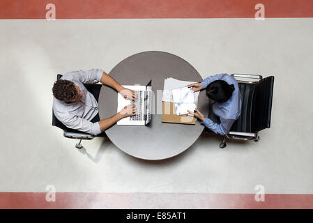Interns working in shared office space Stock Photo