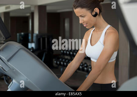Woman exercising in health club Stock Photo