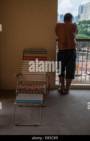 Resident with view from a social housing HDB estate in Singapore Stock Photo