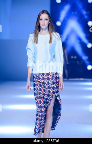 SYDNEY, AUSTRALIA - SEPTEMBER 27: A model showcases designs for // on the runway during MB Presents Australian Style show at Mercedes-Benz Fashion Festival Sydney at Sydney Town Hall on September 27, 2014 in Sydney, Australia. Stock Photo