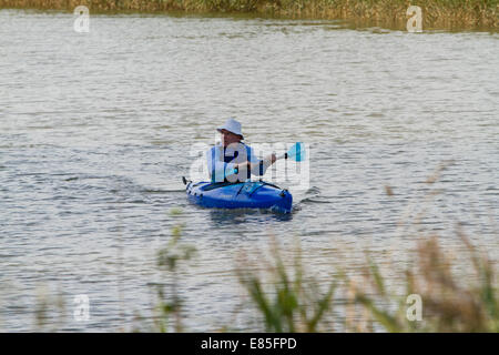 Man in canoe on the River Alde in Snape Maltings in Suffolk Stock Photo