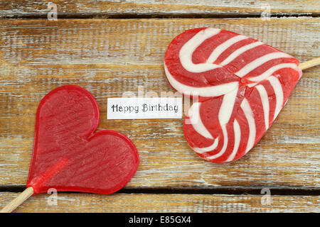 Happy birthday card with two heart shaped lollipops Stock Photo