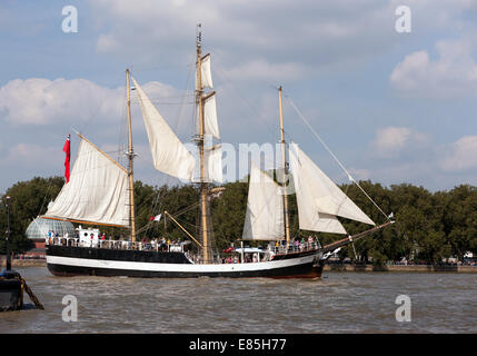 Pelican of London, a mainmast Barquentine, taking part in the parade of Sale, during the Tall Ships Festival, Greenwich. Stock Photo