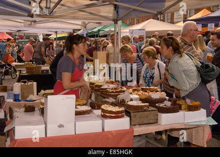 Variety of cakes and pastries on sale at the Farnham Food Festival 2014, Castle Street, Farnham, Surrey, UK. Stock Photo