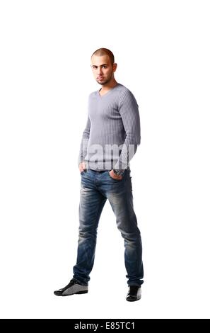 Casual friendly man in jeans and pullover - isolated over a white background Stock Photo
