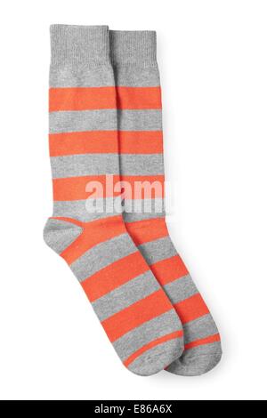 two striped orange and gray socks isolated on white background Stock Photo