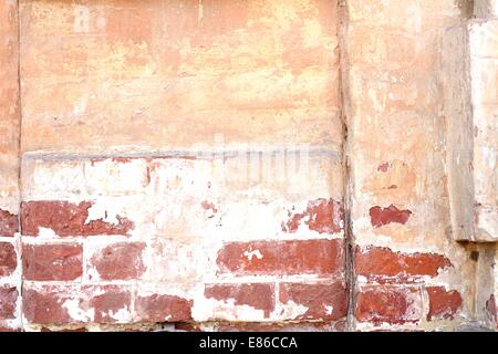 Old dilapidated brick wall of red brick Stock Photo