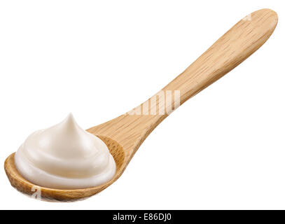 Handful of mayonnaise in wooden spoon.  Isolated on a white background. Stock Photo