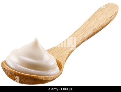 Handful of mayonnaise in wooden spoon. Isolated on a white background. Stock Photo