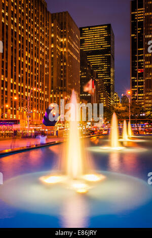 Illuminated fountains on the Avenue of the Americas in Midtown Manhattan, New York City - USA. Stock Photo