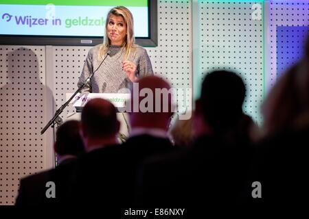 Rotterdam, The Netherlands. 1st Oct, 2014. Queen Maxima of The Netherlands attends a symposium of Platform ?Wijzer in Geldzaken? at the eauditorium of Blijdorp Zoo in Rotterdam, The Netherlands, 1 October 2014. The Queen gives a speech about stimulate of responsible financial behavior. Queen Maxima is honorary board member of the Platform Wijzer in Geldzaken. Photo: Patrick van Katwijk NETHERLANDS AND FRANCE OUT- NO WIRE SERVICE -/dpa/Alamy Live News Stock Photo