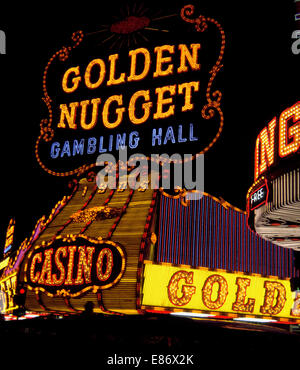 This historic neon sign on the Golden Nugget, one of the oldest casinos in Las Vegas, Nevada, USA, was replaced in 1984 when major renovations were made to the famed Fremont Street property that opened its original gambling hall in 1946. Today it is the largest casino and resort in downtown Las Vegas and boasts more than 2,400 guest rooms.  Photographed at night in 1968. Stock Photo