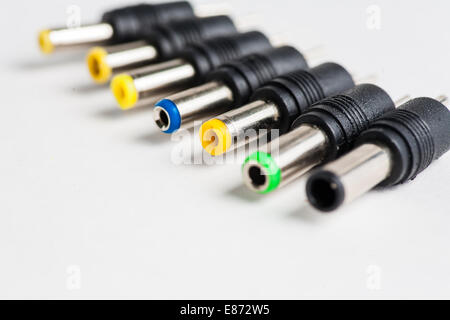 Electric plugs set for laptop on white Stock Photo