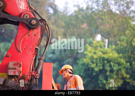 Man @ Work. . Causeway Bay, Hong Kong. Stock Photo