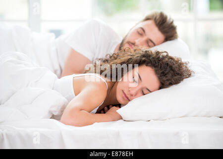 Sleeping couple in the bed Stock Photo