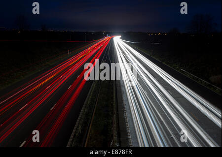 Light trails from the Rush Hour Traffic on the M6 Motorway in Cheshire Stock Photo