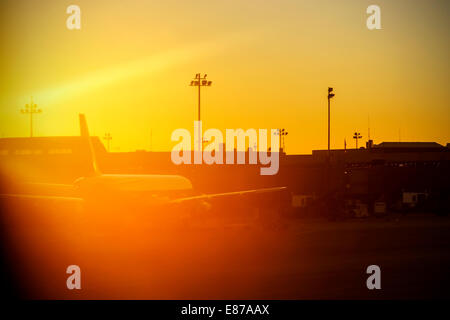 Blurred vintage picture of an airport against sun. Stock Photo