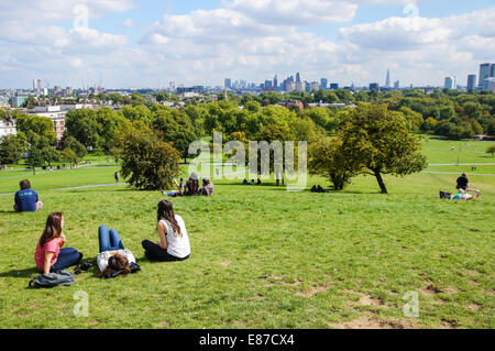 Visitors enjoy view of the London skyline from Primrose Hill London England United Kingdom UK Stock Photo