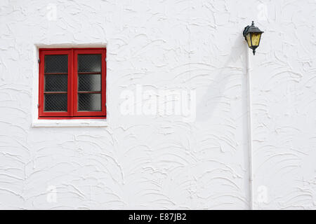 Vintage red window on the white wall Stock Photo