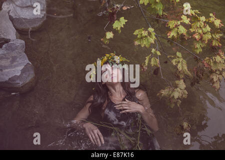 Young beautiful woman in river Stock Photo