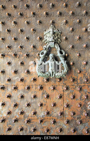 Old iron Door knoker on an old metal door in the Genoa, Italy Stock Photo