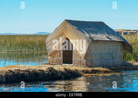 Reed hut, floating islands of the Uros on Lake Titicaca, Puno, Peru Stock Photo