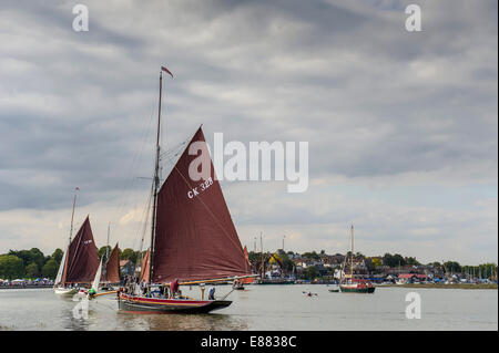 East Coast Fishing Smacks participate in the spectacular Parade of Sail at the Maldon Regatta in Essex. Stock Photo