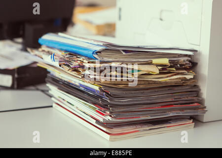 Heap of newspapers and the disorder on a table Stock Photo
