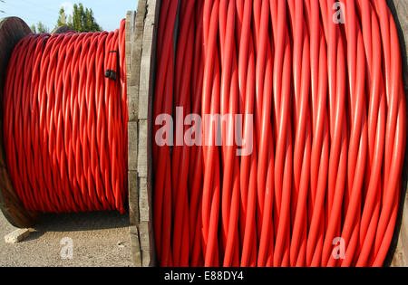 huge coil of high voltage power cable the power the electric utilities Stock Photo