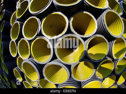 wallpapers of yellow corrugated pipes in a roadworks for laying optical fiber for telecommunications Stock Photo