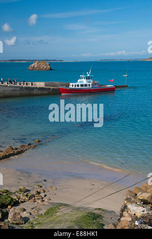 passengers getting ready to board Seahorse boat at St Agnes, Isles of Scilly, Scillies, Cornwall in April Stock Photo