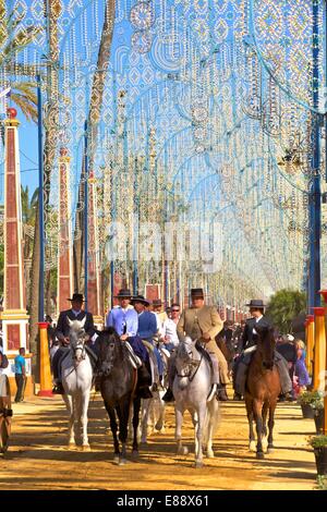 Spanish horse riders in traditional dress at annual Horse Fair, Jerez de la Frontera, Cadiz Province, Andalusia, Spain, Europe Stock Photo