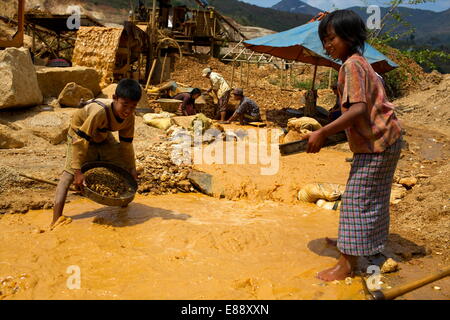 Boys searching for ruby stones in Mogok mining sites, Myanmar (Burma), Asia Stock Photo