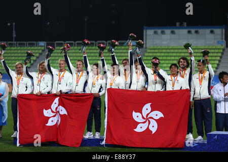 Incheon, South Korea. 2nd Oct, 2014. Silver medalists players of China's Hong Kong pose on the podium during the awarding ceremony of the men's rugby contest at the 17th Asian Games in Incheon, South Korea, Oct. 2, 2014. © Fei Maohua/Xinhua/Alamy Live News Stock Photo
