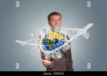 Businessman holding earth with buildings Stock Photo