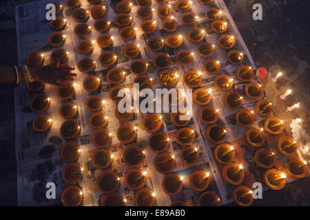 Dhaka, Bangladesh. 2nd Oct, 2014. Lamps burn as a tribute to the goddess Durga in worship at Shakharibaza temple in Dhaka, Bangladesh.Thousands of Bangladeshi devotees celebrate the traditional festival Durga Puja, the worshipping of the Hindu goddess Durga. Common customs include the application of Sindoor powder on married women, the sacrifice of animals and the worship of deities Credit:  Zakir Hossain Chowdhury/ZUMA Wire/Alamy Live News Stock Photo