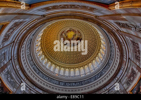 An interior view to the rotunda of the US Capitol. The rotunda is located below the Capitol dome. It's neoclassical architecture style makes the rotunda very impresive. Stock Photo