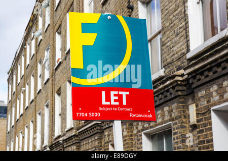 Foxtons real estate sign To Let outside terraced houses in South London England United Kingdom UK Stock Photo