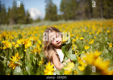 Girl in field of wildflowers Stock Photo