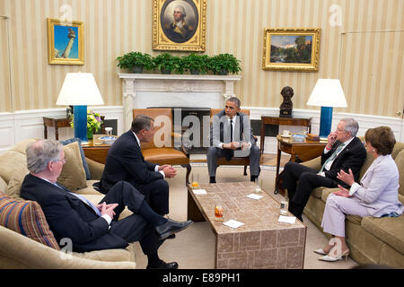 President Barack Obama meets with Congressional leadership to discuss foreign policy issues, including the situation in Iraq, in the Oval Office, June 18, 2014. Seated with the President from left are: Senate Minority Leader Mitch McConnell, R-Ky.; House Stock Photo